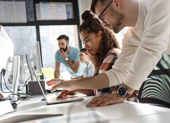 Group of younger professionals collaborating at a table