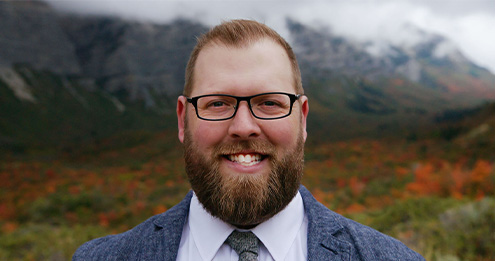 Parker Nielsen, caucasin male with red beard and glasses